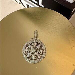 Elegant Silver Pendant with Intricate Design